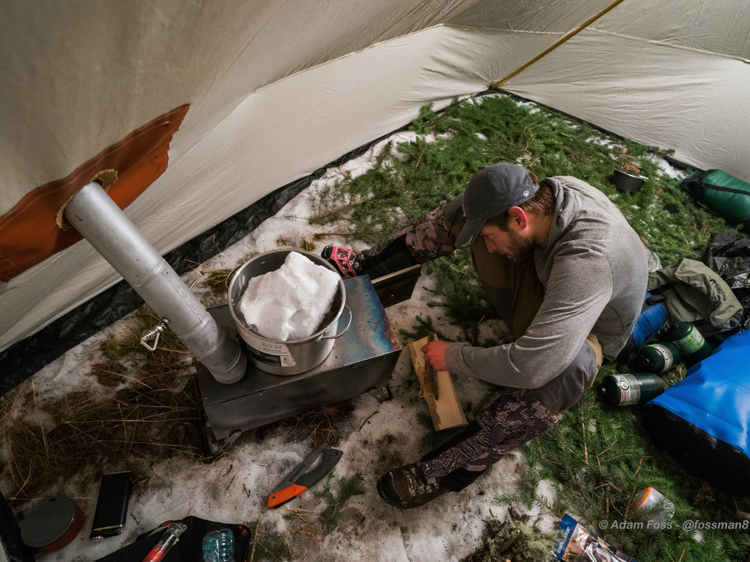 Snowtrekker 8x10 Crew Inside Tent In Winter Man Melting Snow On Stove