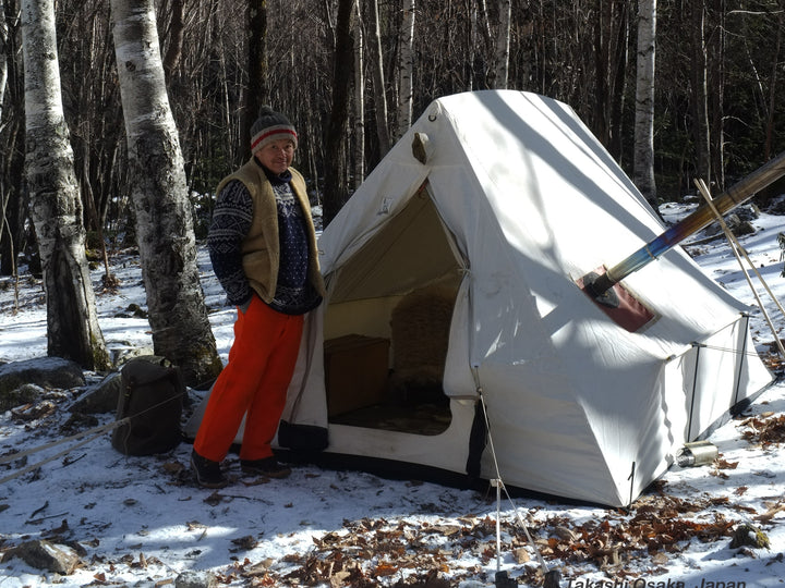 Snowtrekker 8x10 Shortwall Setup In Winter Door Open WIth Man In Front Of Tent