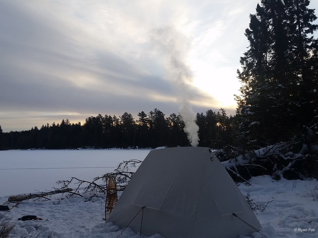 Snowtrekker 8x10 Crew Setup In Winter On Frozen Lake Shore Smoke Coming From Chimney