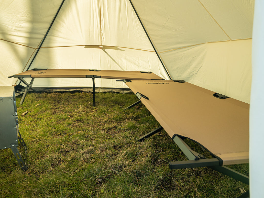 Snowtrekker 9.5x9.5 High Country stove partially visible tan cot along backwall and right sidewall