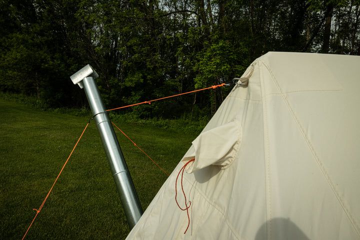 Stove Pipe Support with guy line attached to tent and tent stakes in tripod configuration