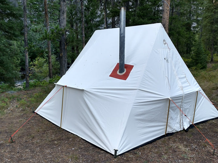 Snowtrekker 11x11 High Country Side View Stove Pipe Exiting Tent vertically with trees in background