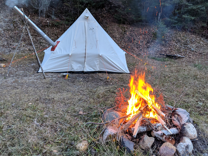 Snowtrekker 9x11.5 Shortwall Tent setup with stove and a campfire 