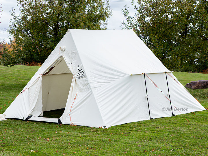 Snowtrekker 13x15 Mega Crew Open Door setup on green grass with trees in background