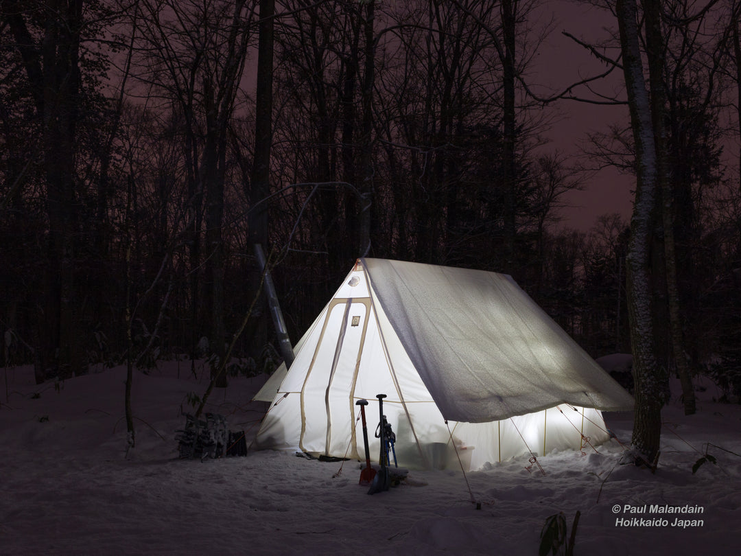 Snowtrekker 9x11.5 Shortwall setup with Tent Fly in snow trees in background lights in tent