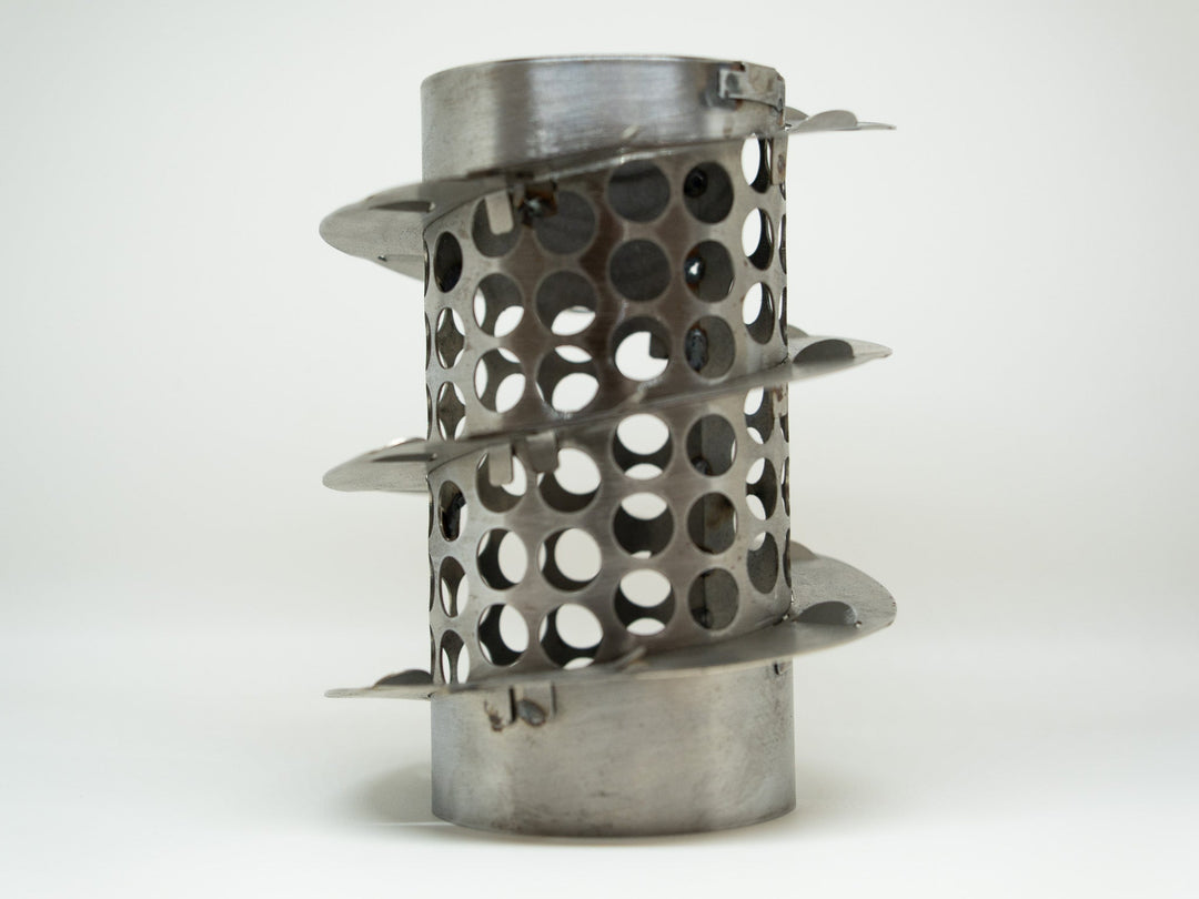 Metallic cylindrical object with perforated design on a white background