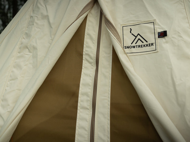 Close-up of a Snowtrekker tent with a visible brand logo.