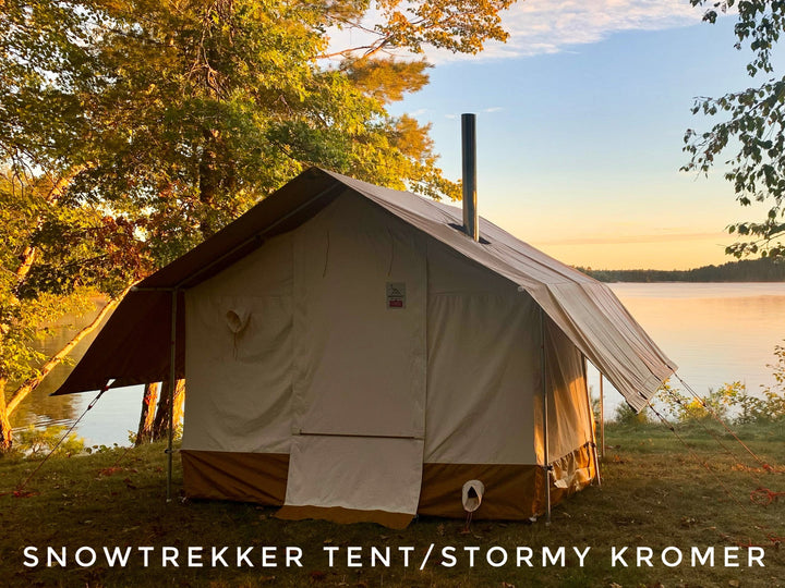 Snowtrekker Tent by Stormy Kromer set up near a lake with trees in the background